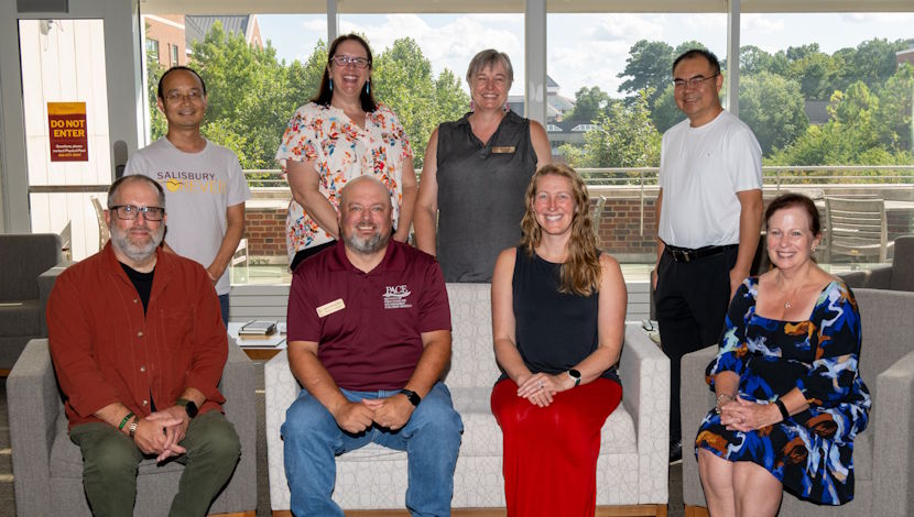 Faculty sitting for a group photo