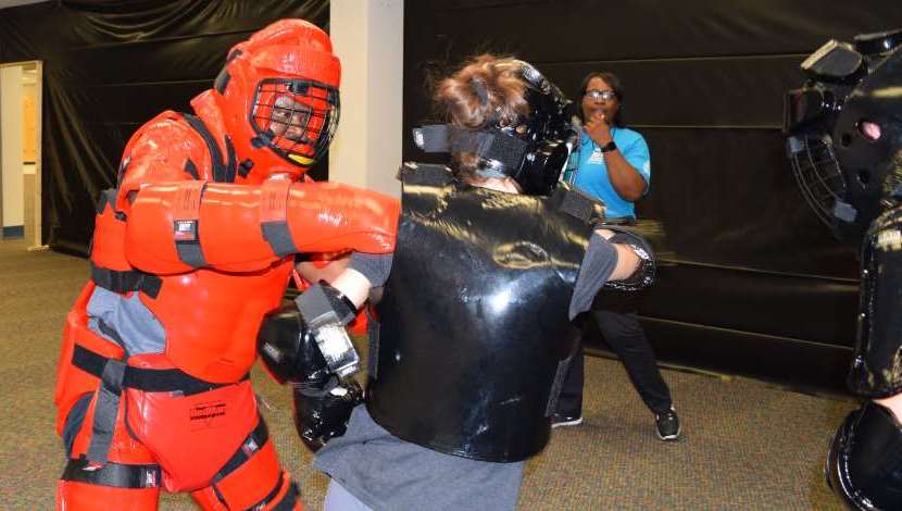 Two people participate in RAD training